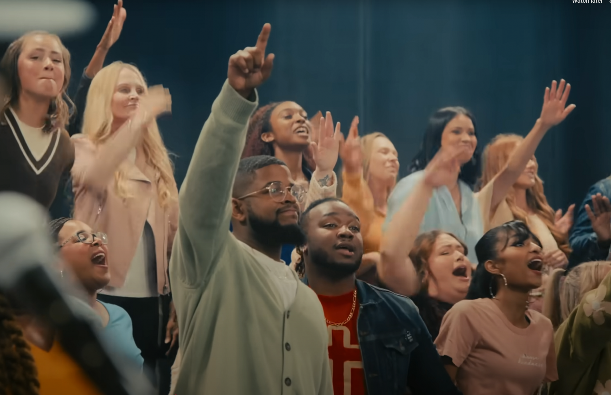 people raising their hands in worship